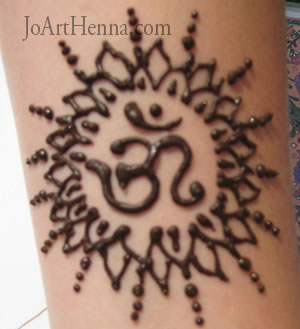 the OM symbol designed using henna