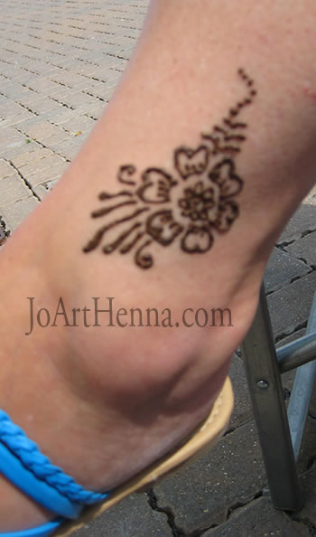 flower henna  design on ankle